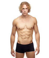 Image showing Muscle, portrait and man with fitness, strong and confident guy isolated against white studio background. Face, male person or model with wellness. sexy and bodybuilder with healthy lifestyle and abs