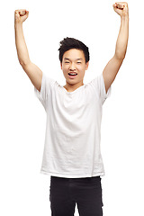 Image showing Yes, winning and portrait with a Asian male teen with youth and achievement in studio. Winner, excited and teenager with white background and victory win with a smile and happiness feeling success