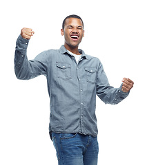 Image showing Happy, excited and man celebration portrait in studio with casual fashion and yes hands from win. Smile, winning and achievement of a African male and model with white background and winner fist