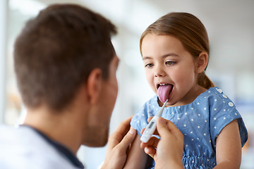 Image showing Kid, doctor and thermometer in mouth for fever, medical risk and assessment of covid infection. Pediatrician, sick girl and temperature test of children, flu virus and healthcare consulting in clinic