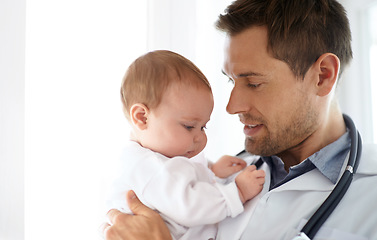 Image showing Man, pediatrician and holding baby for healthcare assessment, wellness consulting and service for children. Kids, medical doctor and newborn in clinic, hospital and expert consultation for pediatrics