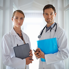 Image showing Portrait of doctors, teamwork and hospital for healthcare management, clinic services and professional consulting. Man, woman and medical employees with folder for collaboration, integrity and trust