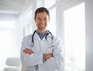 Image showing Portrait of happy man, doctor and arms crossed in hospital for healthcare management, clinic services and help. Male medical employee, professional therapist and confident smile, trust and integrity