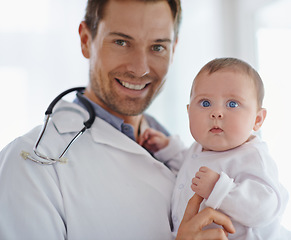 Image showing Portrait, happy pediatrician and holding baby in hospital for medical support and growth. Newborn kid face, man and pediatrics doctor in clinic, healthcare service or smile of trust for children