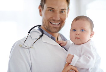 Image showing Portrait, happy man and pediatrician with baby for hospital assessment, medical support and growth. Pediatrics doctor holding newborn kid in clinic for healthcare service, trust and helping children