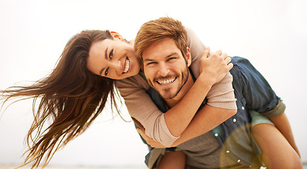 Image showing Love, hug and portrait of couple piggyback at beach, hug and laughing while bonding outdoor. Face, embrace and happy man with woman at the ocean for travel, freedom or vacation, holiday or Miami trip