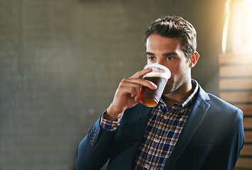 Image showing Business man at pub, drinking beer and relax, social time or event with professional person at bistro. Hospitality industry, male customer at restaurant enjoying alcohol drink, thirsty with mockup
