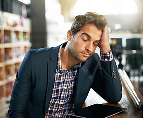 Image showing Stress, burnout and businessman with a digital tablet in the library while working on a corporate project. Technology, tired and professional male employee with a mobile for a report in the workplace