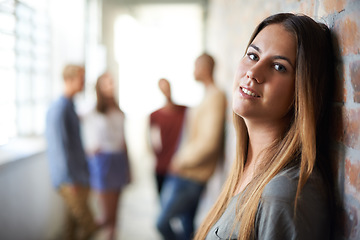 Image showing University, corridor and portrait of woman for education, knowledge and learning in building. College, academy scholarship and female student with friends on campus for studying, class and school