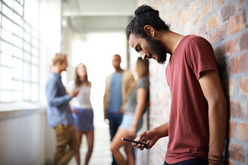 Image showing School, phone and college with man in hallway for social media, technology or internet. Eduction, learning and scholarship with student on university campus for connection, contact or text message