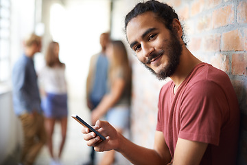 Image showing College, phone and portrait of man in hallway for social media, technology or internet. Eduction, learning and scholarship with student on university campus for connection, contact or text message