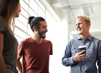 Image showing Laughing, students and coffee in a college hallway for discussion, happiness and a drink. Group of men and a woman as friends at campus or university for a funny chat or conversation about education