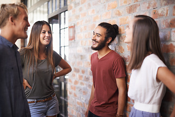 Image showing Happy, friends and students talking together in a hallway for discussion, learning or a chat. Diversity group of women and men at campus or university to talk about education, project or school work