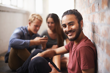 Image showing University, happy and portrait of man with friends for education, knowledge and learning. College, academy scholarship and male student smile in hallway on campus for studying, class or school