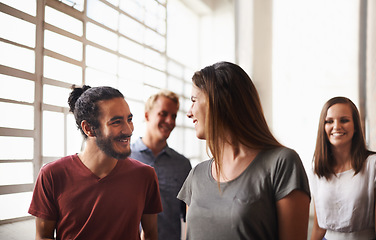 Image showing College, friends and talking while walking together in hallway for discussion or chat. Group of diversity men and women students at campus or university for happy conversation about education career