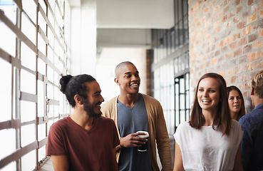 Image showing College, friends and students walking and talking with coffee in a hallway for a discussion. Group of diversity men and a woman at university for a funny chat or conversation about education career