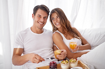 Image showing Breakfast in bed, portrait and morning couple relax with food, love bond and enjoy quality time together. Marriage romance, meal or happy people in hotel bedroom for Valentines Day in Toronto Canada