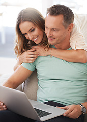 Image showing Laptop, sofa and happy couple with home internet for online planning, website review and check application together. Hug, love and affection of mature woman, partner or people on computer technology