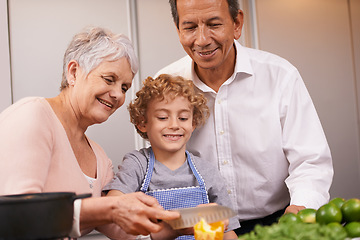 Image showing Smile, happy boy or grandparents teaching cooking skills for healthy dinner with vegetables diet at home. Learning, young male child helping or grandmother with old man, kid or food meal in kitchen