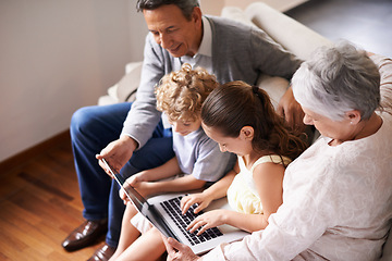 Image showing Grandparents, laptop or children typing, learning how to type or playing online game in family home together. Education, child development or kids siblings on computer with grandmother or grandfather