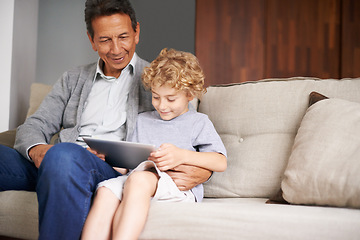 Image showing Tablet, happy kid or grandfather streaming movie or film on online subscription in retirement at home to relax. Grandparent or child loves watching fun videos with a senior or mature old man on sofa