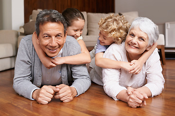 Image showing Floor, piggyback or portrait of grandparents with happy kids playing or hugging with love in family home. Elderly grandma or fun old man relaxing or bonding to enjoy time with children in retirement