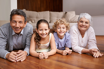 Image showing Portrait, relax or grandparents on the floor with happy kids smiling together in family home in retirement. Senior grandma, smile or fun children siblings bonding to enjoy quality time with old man