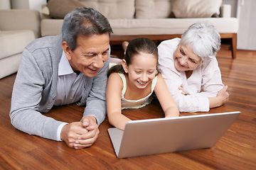 Image showing Laptop, floor or grandparents with happy girl for movie streaming online subscription in retirement at home. Child, relaxing together or grandmother watching funny comedy videos with a senior old man