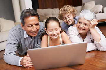 Image showing Laptop, relax or grandparents with happy kids for movie streaming online subscription in a family at home. Children siblings, floor or grandmother watching videos in retirement with a senior old man