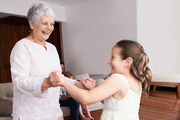 Image showing Holding hands, dance or happy grandmother with a child playing or laughing with joy in family home. Grandma dancing, kid smiling or funny old woman relaxing or bonding together in retirement or house