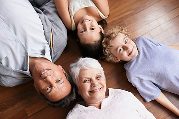 Image showing Portrait, floor or top view of grandparents with happy kids smiling together in family home or retirement. Senior grandma, relax or fun children siblings bonding to enjoy quality time with old man