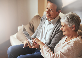 Image showing Tablet, relax or old couple streaming film or movies on online subscription in retirement at home together. Love, pointing or senior woman watching videos with a happy elderly man in living room sofa