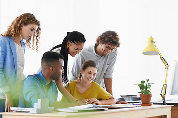 Image showing Diversity, happy business people and writing in meeting for collaboration, planning or strategy at the office. Group of diverse employees working on paperwork, documents or brainstorming at workplace