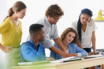 Image showing Businessman, coaching and documents in teamwork planning for strategy and collaboration at office. Business people listening to help or mentor training staff in diversity group project at workplace