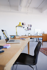 Image showing Empty office, startup or laptop on wooden table in workplace, company or workspace for business. Background, modern interior design or closeup of furniture with nobody or chair in digital agency