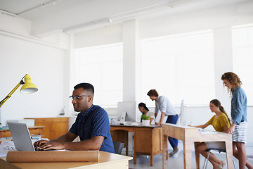 Image showing Journalist, office or black man typing on laptop working on email, business project or online research. Computer, data or serious worker copywriting on blog, reports or internet article with focus