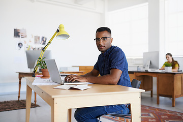 Image showing Journalist, portrait or serious black man typing on laptop working on email, business project or online research. Computer, digital or focused worker copywriting on blog, reports or internet article