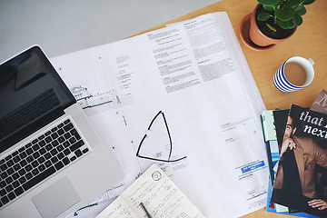 Image showing Notebook, laptop and blueprint on office desk above for architecture planning, strategy or layout. Top view of building paperwork, floor plan or architect notes for construction ideas on workspace