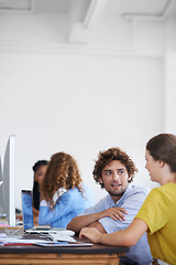 Image showing Teamwork, talking or creative people planning in startup for a research project in office desk together. Collaboration, smile or young woman helping or speaking of design ideas on notes or paperwork