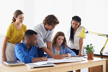 Image showing Diversity, businessman and coaching on documents in planning, strategy or training staff at office. Business people listening to coach in teamwork for group project, plan or paperwork at workplace