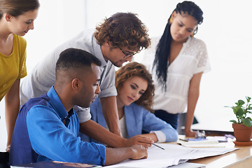 Image showing Businessman, coaching and writing on documents for planning, strategy or brainstorming at the office. Business people listening to coach ideas in teamwork for group project plan or training staff