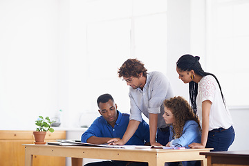 Image showing Businessman, coaching and paperwork in meeting for planning, team strategy or training staff at the office. Business people with coach and document in teamwork for group project or plan at workplace