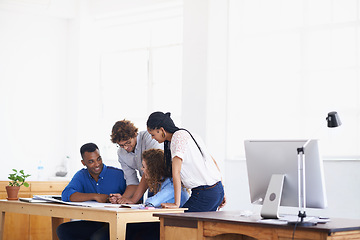 Image showing Creative business people, documents and planning in meeting for team collaboration or strategy at the office. Group of employees working on paperwork, project plan or brainstorming ideas for startup