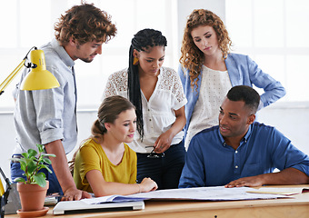 Image showing Business people, blueprint and meeting in collaboration for planning, architecture or construction at office. Architect group working on paperwork for project or floor plan together at the workplace