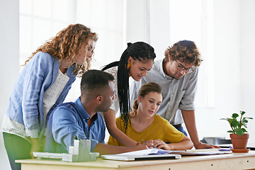 Image showing Diversity, business people and writing in meeting for collaboration, planning or strategy at the office. Group of diverse employees working on paperwork, documents or team brainstorming at workplace