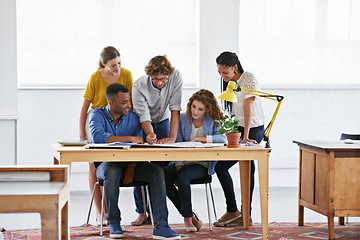 Image showing Diversity, business people and documents in collaboration, meeting or strategy for team brainstorming at the office. Group of employees working on paperwork or project plan in teamwork at workplace