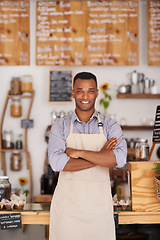 Image showing Black man, portrait and barista with arms crossed in cafe with pride for career or job. Waiter, smile and confidence of African person from Nigeria in restaurant, small business and coffee shop.