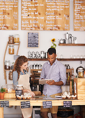 Image showing Small business, talking and employees with a tablet, digital planning or share ideas for profit growth. Black man, woman or coworkers with technology, store or happiness with communication at a store