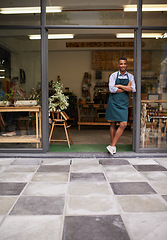 Image showing Welcome portrait, coffee shop and man as small business owner at front door with a smile. Entrepreneur person as barista, manager or waiter in restaurant for service, career pride and startup goals