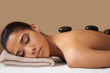 Image showing Woman, rock or back massage in spa to relax for zen, sleeping or wellness physical therapy in resort. Relaxed girl client in beauty salon to exfoliate for luxury skincare healing treatment or detox